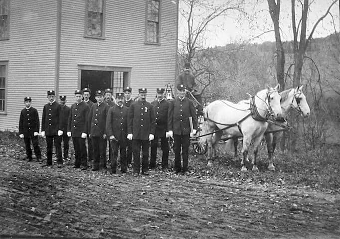 1904 photo of W.R. Spaulding sitting on the hand-pumper at Yosemite with his team of white horses. Photo provided by Ted Spaulding