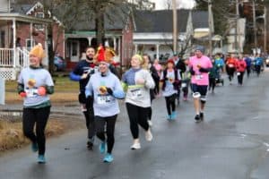 Runners start out on the EdgarMay Thanksgiving Day 5k race