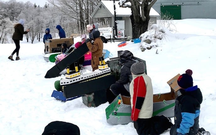 Cardboard sledders line up for race at Winter Carnival