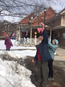 Members of the United Church of Ludlow add hearts to trees in town.