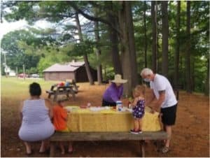 Playgroup coordinator Celese Marquise prepares an activity for the children arriving to playgroup at the Commons Park in Springfield.