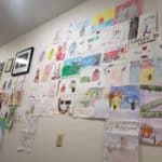 All of the entries received are hung up on a white wall at the fire station. There are multiple entries forming a collage