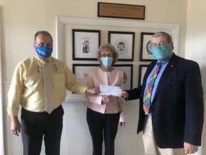 Bellows Falls Rotary Club President Bill Stevens presenting the PPE Rotary 7870 District Global Grant check to Kurn Hattin Homes for Children Executive Director Stephen Harrison and Co-Executive Director Susan Kessler.