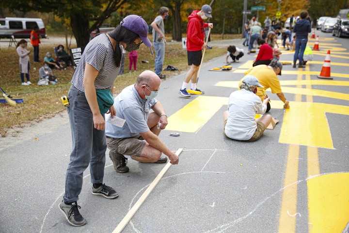 Community members in Putney gathered to paint a Black Lives Matter mural outside Putney Central Elementary