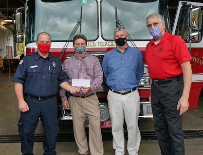 From left: Springfield Firefighter Bay Wheeler, Springfield Rotary Club President Jerry Farnum, Rotarian Jeff Mobus, and Springfield Fire Chief Russell Thompson.
