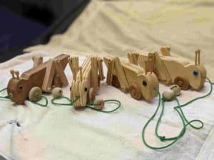 Wooden grasshopper toys created to inspire STEM imagination