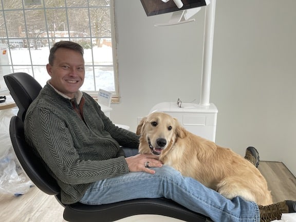 Dr. Fauver and his dental therapy dog Winston