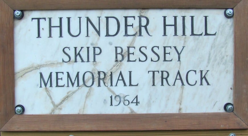 Wood and marble plaque reads "Thunder Hill Skip Bessey Memorial Track 1964"