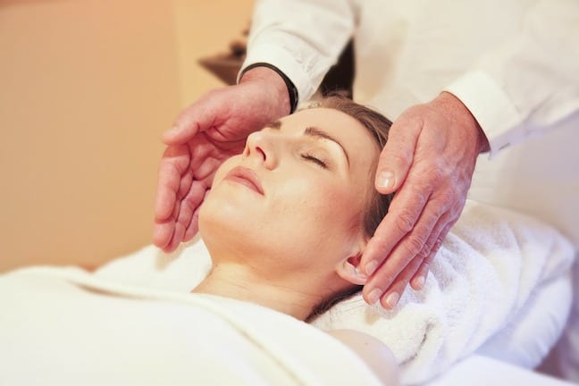 Learn how reiki can aid your health and healing. Stock photo