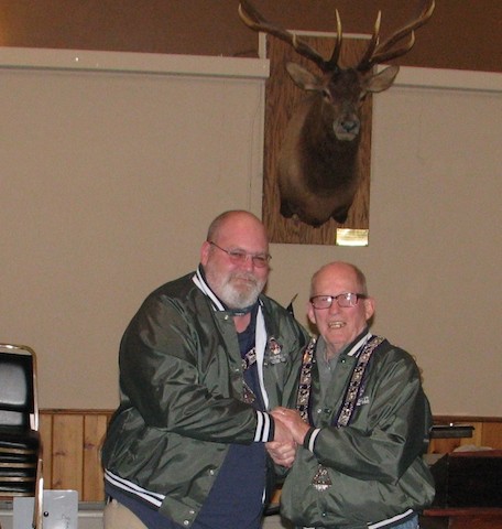 PER Jim Morse, left, is presented the Springfield Elks Lodge Green jacket by former winner Mike Gunn.