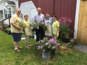 Friends’ volunteers Jerry Cloutier, Sally Wadsworth, Mike Cooney, Linda Gifkins, and Nancy Ferrucci show off some of the many colorful annuals and perennials that will be for sale at the 2019 plant sale in Wardsboro.