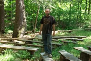David Stern at the amphitheater in the woods on his Bald Hill farm. Photo by Bill Lockwood