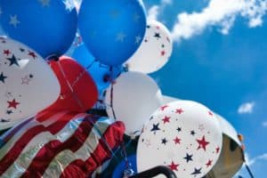 Red, White, and Blue balloons with stars. Photo by Tom Dahm, Unsplash