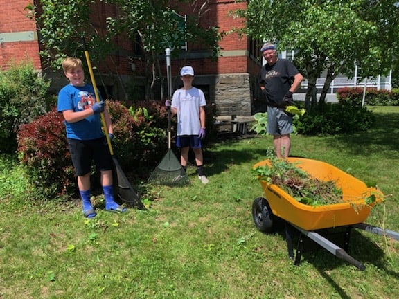 Sawyer Sheppard, Mason Cassidy & Dick Dunseith doing much needed weeding at the Black River Academy Museum