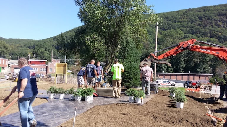 Volunteers, mostly Bellows Falls Firefighters, working on the new Brown-Fuller Memorial Park on the site of the former Star Hotel in Bellows Falls