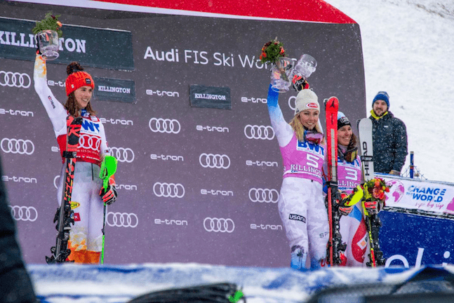 United States’ Mikaela Shiffrin, center, stands atop the podium along side second-place finisher Petra Vlhova of Slovakia, left, and third-place finisher Wendy Holdener of Switzerland, right, after Sunday’s Killington Cup women’s Alpine skiing slalom race at Killington Mountain. Photo by Hannah Dicton, Rutland Herald.