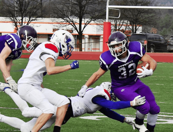 Bellows Falls' Jeb Lober (32) rushes the ball during the Terriers' Division II championship win against Mount Anthony Saturday at Alumni Field in Rutland. Photo by Doug MacPhee