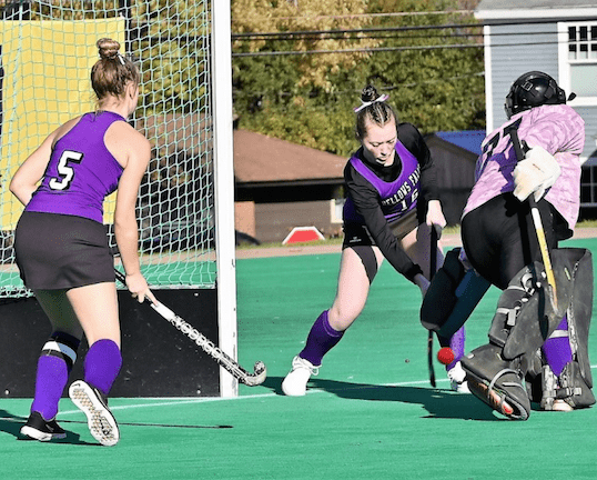 This bad hop gave South Burlington its first goal as Grace Wilkinson, Jaia Caron, and Julianna McDermid try for the save. Photo by Christopher Shaban, Eagle Times
