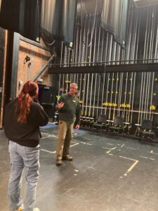 Greg Pregent explains elements of a control system backstage at the Colonial Theatre. Photo provided