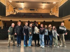 TaDa! Flanked by the Colonial’s Greg Pregent (far left) and Sam Clark (far right), Kurn Hattin Homes’ staff and students take the stage for a bow during their recent CAP visit to the theatre. Photo provided