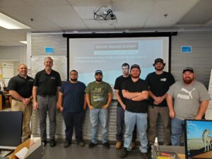 Diesel technicians Adrian Emrick and Ryan Labbe (second and third from right) from Advantage Truck Group in Westminster were among the five ATG technicians who recently earned the Daimler Trucks North America Professional certification. Photo provided